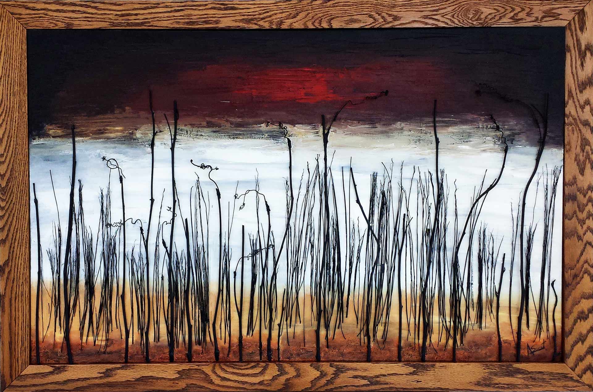 'October Skies' by Alex Sauret is a striking minimalist depiction of a leafless forest. The trees, crafted from real branches, create a tactile, three-dimensional effect. The horizon is rendered in soft white and light blue hues, evoking a sense of calm and distance. In stark contrast, the sky above is painted with dramatic red and black tones, infusing the scene with intense emotion and a hint of foreboding. This juxtaposition of serene and turbulent elements captures the viewer's attention, highlighting the beauty and complexity of nature.